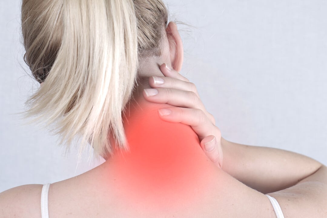 Woman with neck pain close up. Pain relief concept